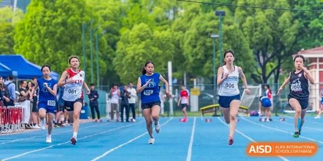 A female Concordia International School Shanghai student running down a blue track during a race.
