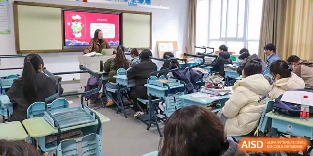 Students seated at their desks while a teacher leads the session in a classroom setting at the  Hefei No.1 High School.
