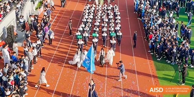 Students marching in formation on the running track during an opening ceremony or sports day event at the Hefei No.1 High School.