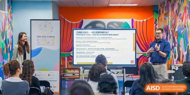 An image showing a teacher giving a presentation to students in a classroom at Wellington College International Shanghai.