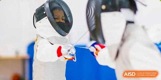 An image showing a fencer wearing a mask and holding an epee at Wellington College International Shanghai.