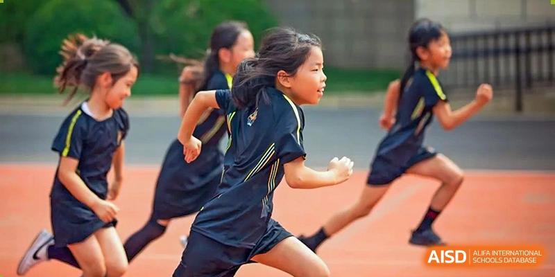 An image showing a girl running on a track during a race at Wellington College International Shanghai.