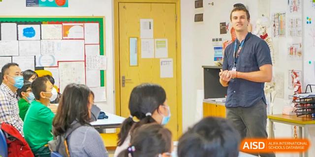 A classroom scene at BASIS International School Guangzhou with students seated at desks facing the front.