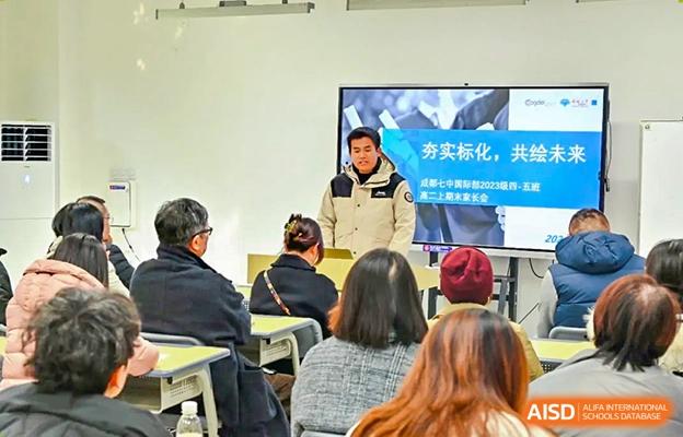 Guest speaker giving a presentation to Chengdu No.7 High School International Department students and parents in a classroom.