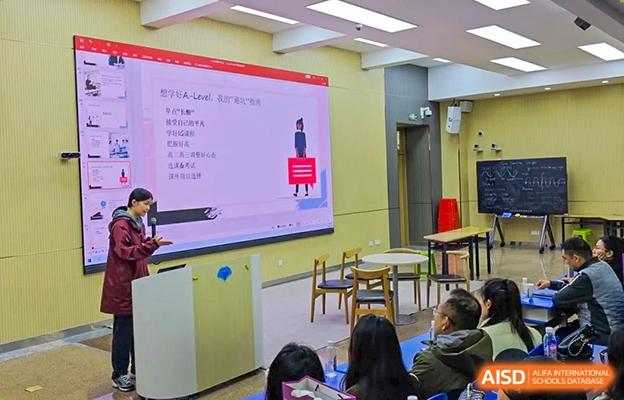 Students at Chengdu No.7 High School International Department attending a lesson with an animated presentation displayed on the classroom screen.