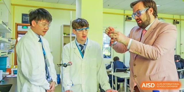 Two male students and a teacher from Harrow International School Beijing (AISL Beijing) are conducting an experiment in the school science lab.