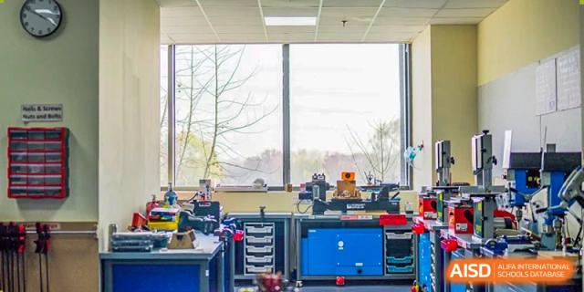A wide view of a modern science laboratory at Harrow International School Beijing (AISL Beijing) with equipment and computers.