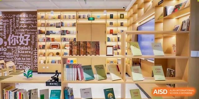 A close view of a floor-to-ceiling wooden bookshelf display in the school's modern library at BEIJING CHAOYANG TONGWEN FOREIGN LANGUAGE SCHOOL.