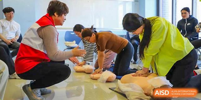 A photo showing students in a class being taught health and nutrition, at Beijing Foreign Studies University International Curriculum Center.