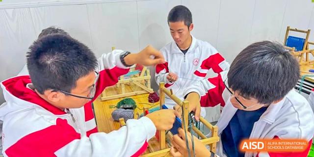 Students from Shijingshan School of The High School Affiliated to Renmin University of China work on a science project in a lab.