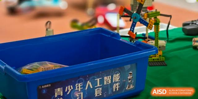 A blue storage bin for artificial intelligence and robotics kits used in student workshops. Beanstalk International Bilingual School (BIBS) - Chengdu
