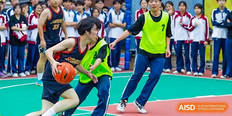 A close-up action shot of two students' feet running on a court during a sports event at The Experimental School Affiliated with Zhuhai No.1 High School.