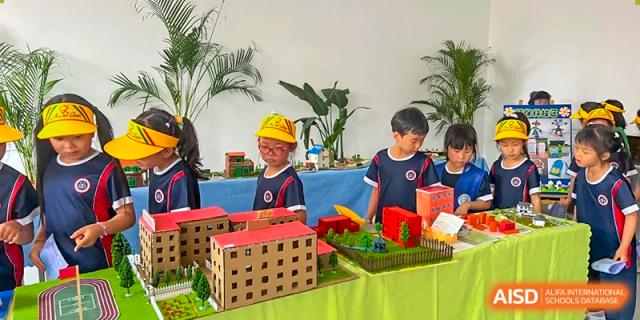 Students presenting a project at a school fair at Beijing Zhongguancun Foreign Language School.