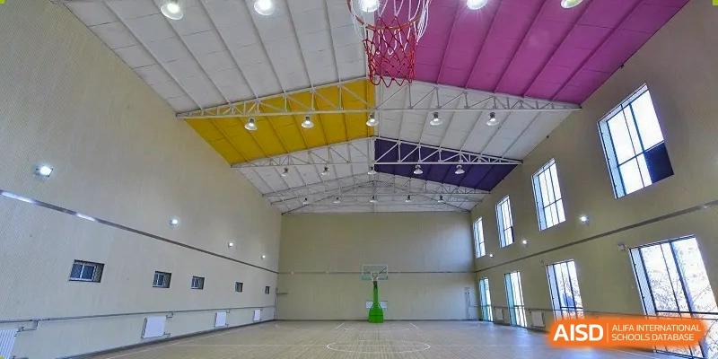A photo showing a sports hall, at Beijing Zhongguancun Foreign Language School.