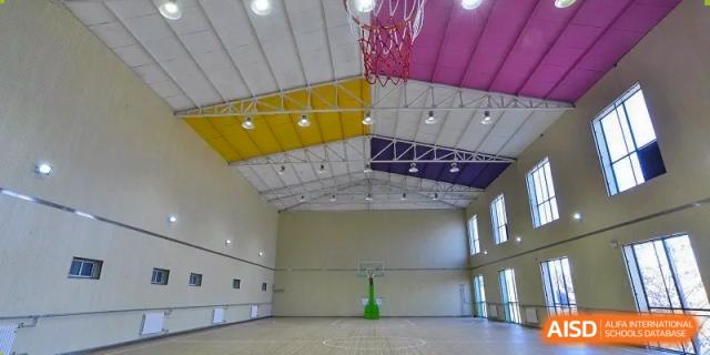A photo showing a sports hall, at Beijing Zhongguancun Foreign Language School.
