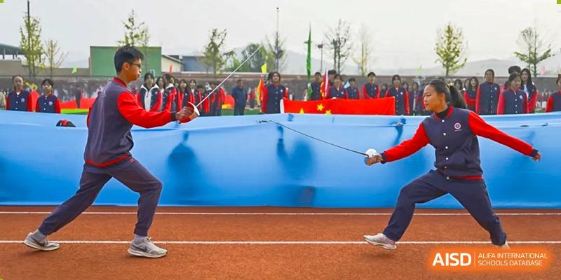 A photo showing two students in a fencing competition, at Beijing Zhongguancun Foreign Language School.