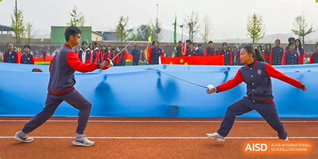 A photo showing two students in a fencing competition, at Beijing Zhongguancun Foreign Language School.