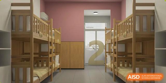An interior shot of a quiet study or library area at Changsha Lushan Zhongjia School, showing wooden bookshelves and a large number '2' visible in the background.