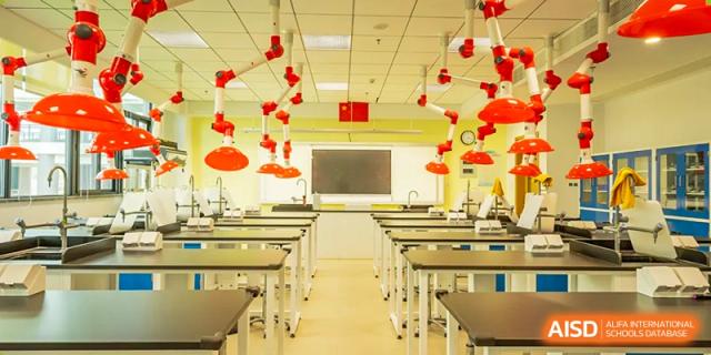 A modern, empty classroom or science lab at Chiway Bilingual School Xiamen with red decorative lanterns hanging from the ceiling.