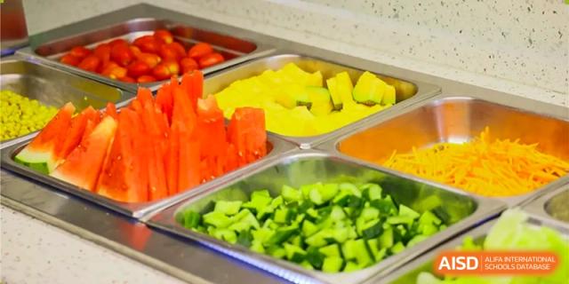 Fresh fruit and chopped vegetables in a salad bar at Dulwich College Beijing.