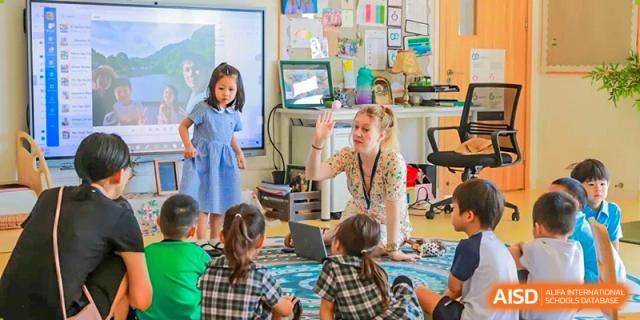 Harrow International School Shanghai students in a classroom, listening to their teacher.