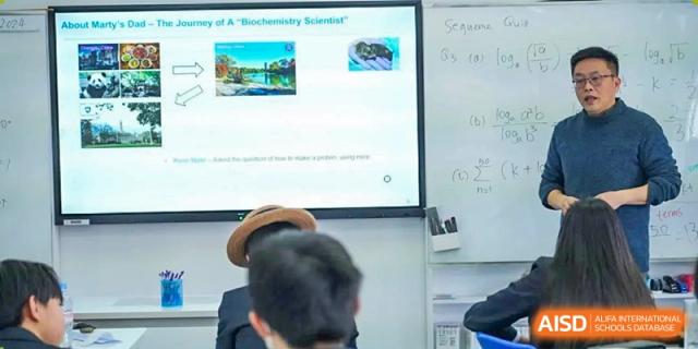 Harrow International School Shanghai students in a classroom with a presentation on a screen.