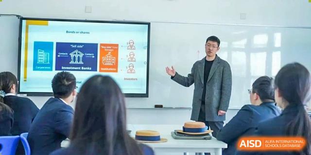 A teacher from Harrow International School Shanghai giving a presentation in a classroom.