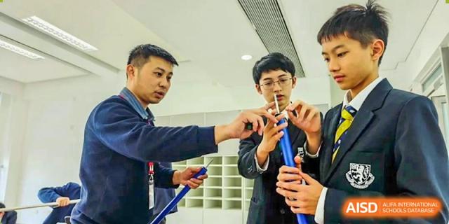 Students from Harrow International School Shanghai working on an engineering project.