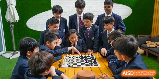 Harrow International School Shanghai students playing a game of chess.