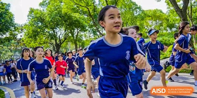 A female student from Harrow International School Shanghai running in a race.