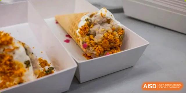 A single serving of a dessert in a cone, topped with whipped cream and sprinkles at the International Curriculum Center of RDFZ.