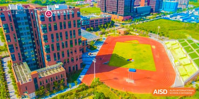 An aerial view of the outdoor running track and buildings of NANJING THOMAS SCHOOL.