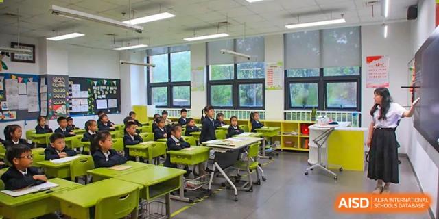 Students from Rugao International Academy BFSU working in a classroom.