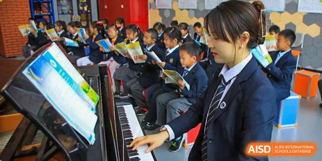 Students from Rugao International Academy BFSU playing piano and other musical instruments.