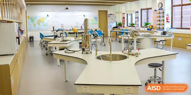 View of a clean, modern science or Sias International School laboratory with workstations and built-in sinks.