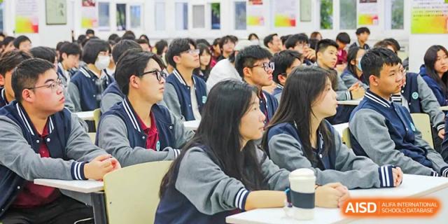 Students at The Experimental School Affiliated to Nanjing Normal University observing a classroom presentation.