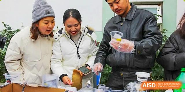 A student at The Experimental School Affiliated to Nanjing Normal University serving themselves food from a buffet.