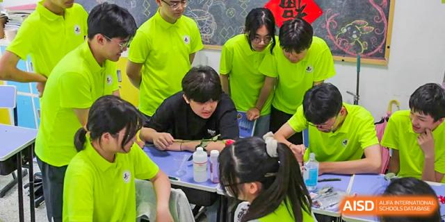Students at The Experimental School Affiliated to Nanjing Normal University working together on a project.