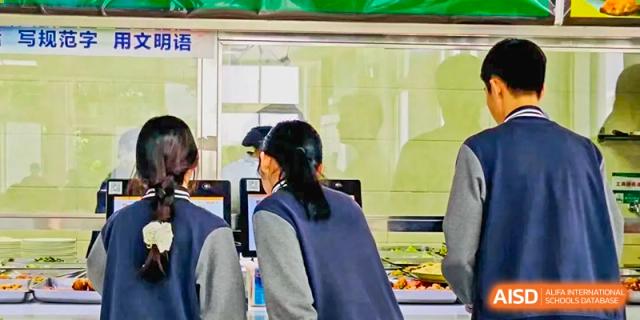 Students at The Experimental School Affiliated to Nanjing Normal University eating lunch in the school cafeteria.