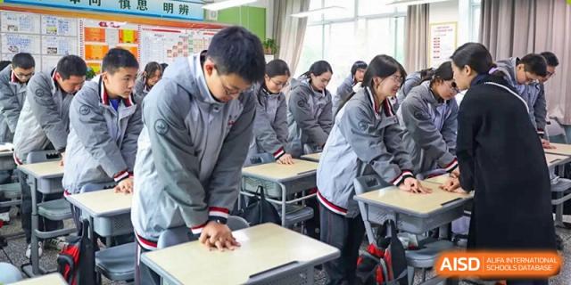 Weiming School Chengdu Qingbaijiang students working on a group assignment in a classroom.
