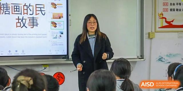 A teacher speaking to students in a classroom at Weiming School Chengdu Qingbaijiang.