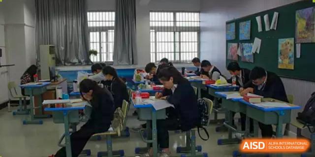 Students focused on individual study and assignments in a quiet classroom at Wenzhou No.21 Middle School.