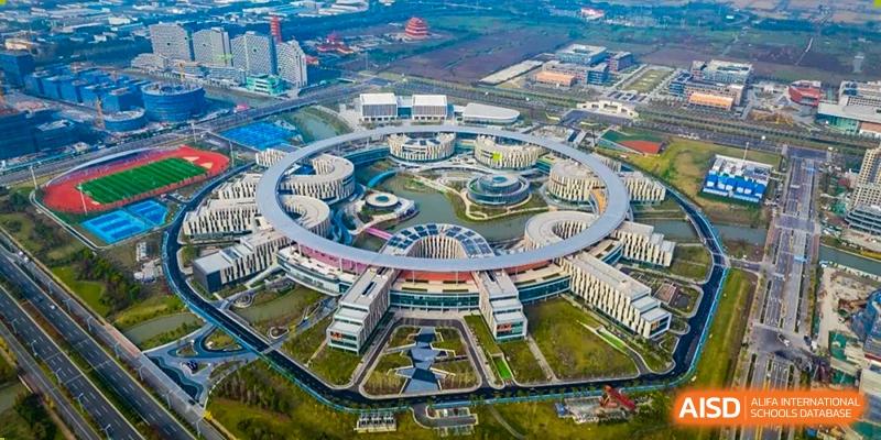 An aerial view of the massive, modern, and circular-design campus of Wuhan Optics Valley ULINK School.