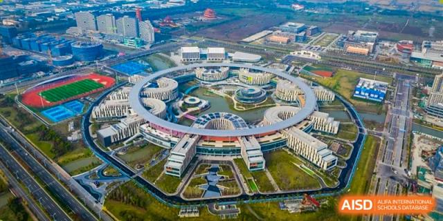 An aerial view of the massive, modern, and circular-design campus of Wuhan Optics Valley ULINK School.