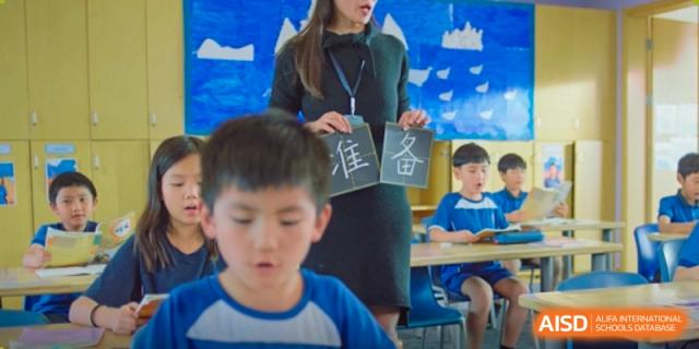 A young student from Wycombe Abbey School Nanjing focused on a task in a classroom.