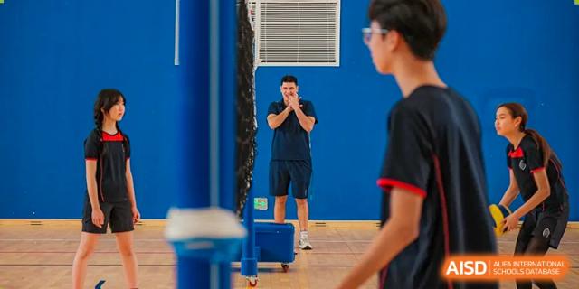 A teacher from Wycombe Abbey School Nanjing instructing a student during a class.