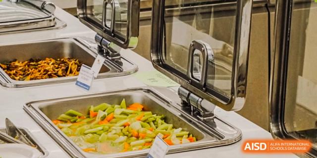 Fresh vegetables in a food warmer at Wycombe Abbey School Nanjing cafeteria.