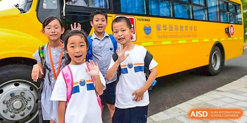 Group of cheerful students at Yew Wah International Education School of Shanghai Lingang.