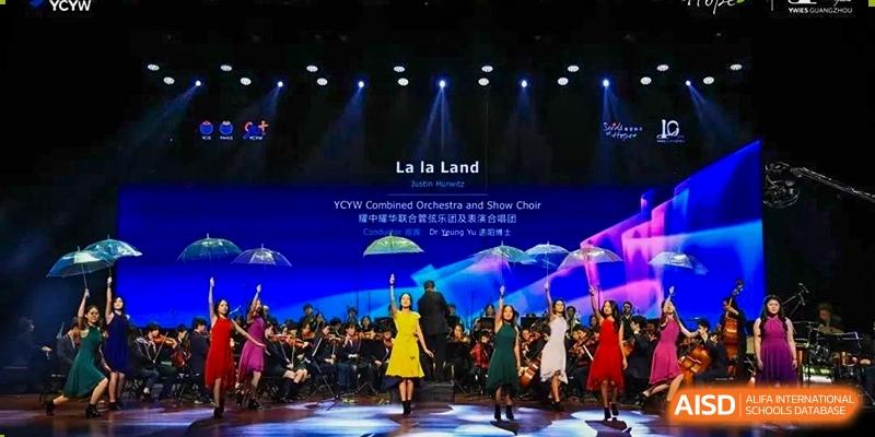 Orchestra and performers on stage at Yew Wah International Education School of Shanghai Lingang.