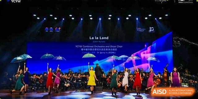 Orchestra and performers on stage at Yew Wah International Education School of Shanghai Lingang.